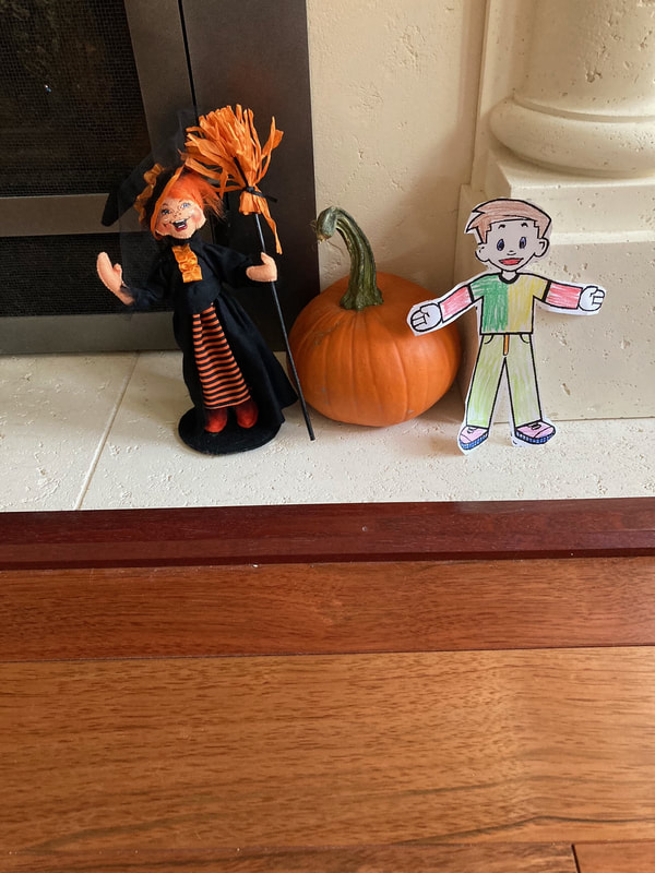 Flat Stanly hiding in the Halloween decorations