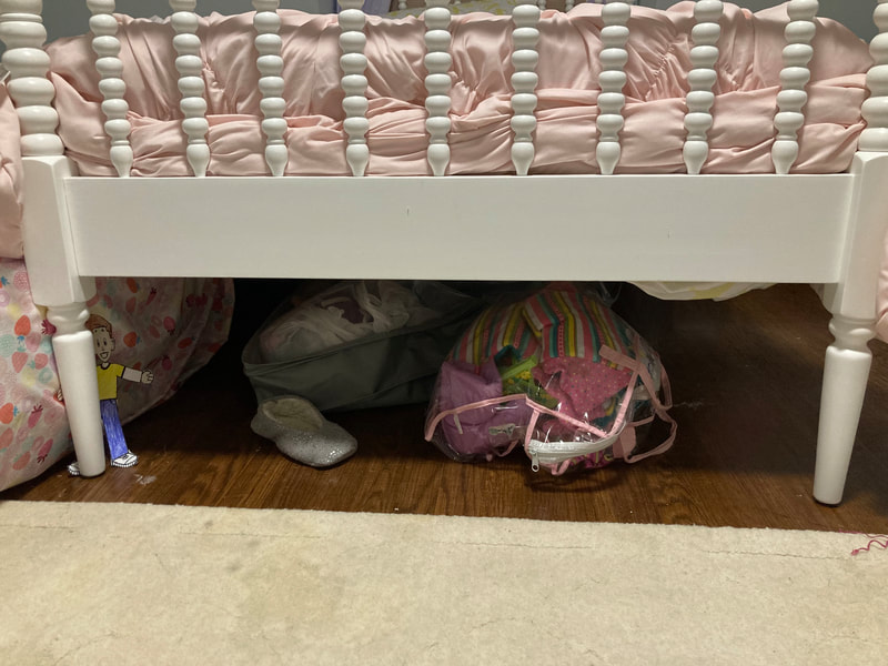 Flat Stanley hiding under the bed