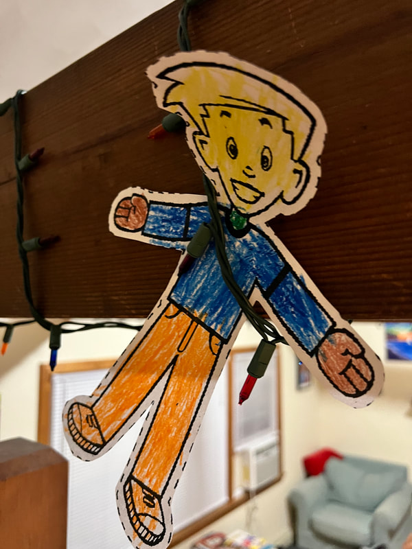 Flat Stanly hanging in the fairy lights